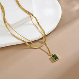 18k gold layered necklace featuring a emerald colour designed to be waterproof and hypoallergenic for everyday wear.