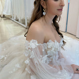 Abstract Gold earrings adorned with acrylic petals, designed for brides.