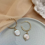 18k gold textured hoop earrings featuring a coin pearl