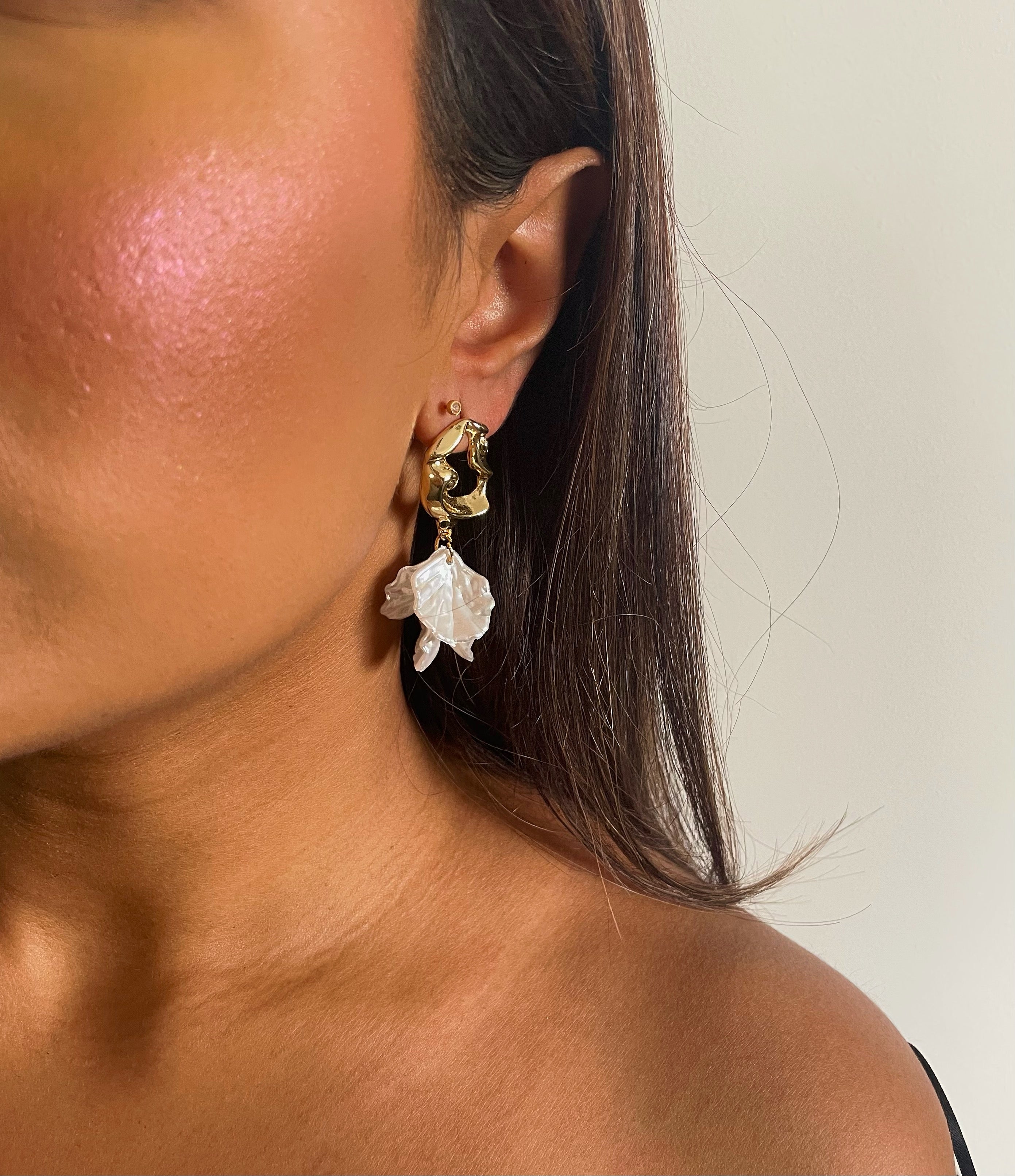 Abstract Gold earrings adorned with acrylic petals, designed for brides.