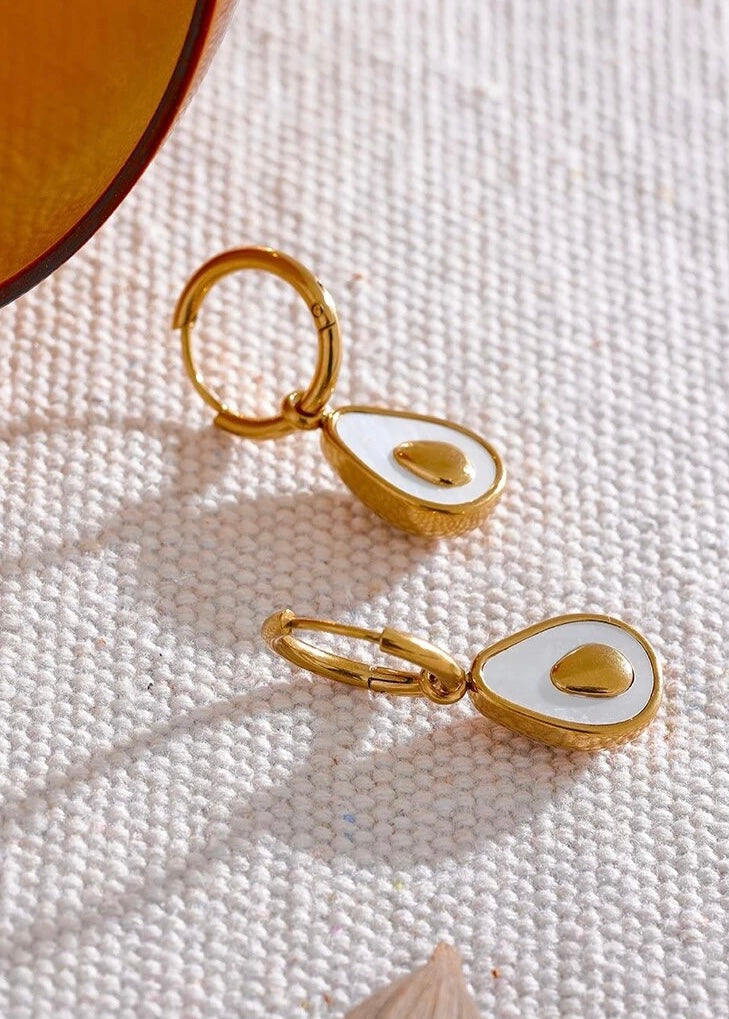 18k gold avocado earrings with a mother of pearl inner, designed to be hypoallergenic and tarnish-resistant for lasting wear