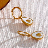 18k gold avocado earrings with a mother of pearl inner, designed to be hypoallergenic and tarnish-resistant for lasting wear