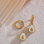 18k gold avocado earrings with a mother of pearl inner, designed to be hypoallergenic and tarnish-resistant for lasting wear