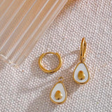 18k gold avocado earrings with a mother of pearl inner, designed to be hypoallergenic and tarnish-resistant for lasting wear