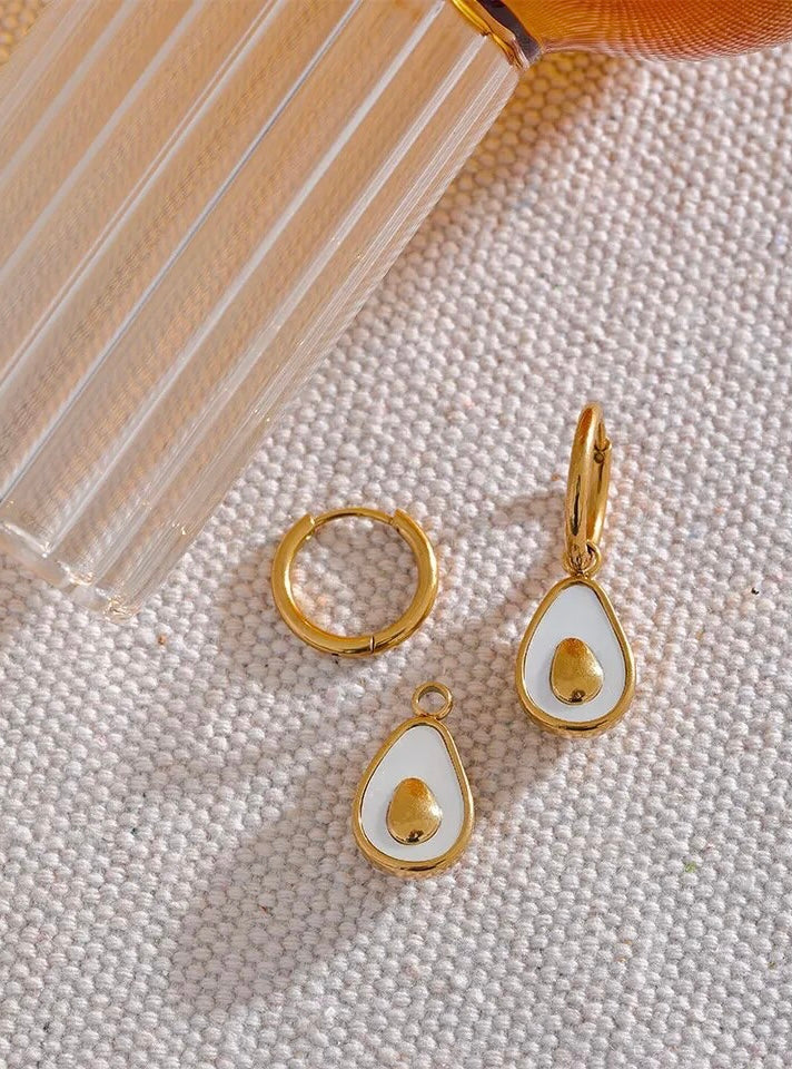 18k gold avocado earrings with a mother of pearl inner, designed to be hypoallergenic and tarnish-resistant for lasting wear