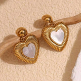 18k gold heart-shaped earrings featuring a mother of pearl inner layer, designed to be hypoallergenic and waterproof