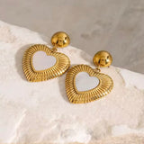 18k gold heart-shaped earrings featuring a mother of pearl inner layer, designed to be hypoallergenic and waterproof