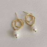 Abstract 18k gold earrings with a pearl drop, perfect for adding a unique and elegant touch to bridal attire