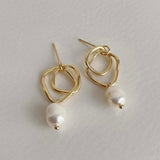 Abstract 18k gold earrings with a pearl drop, perfect for adding a unique and elegant touch to bridal attire