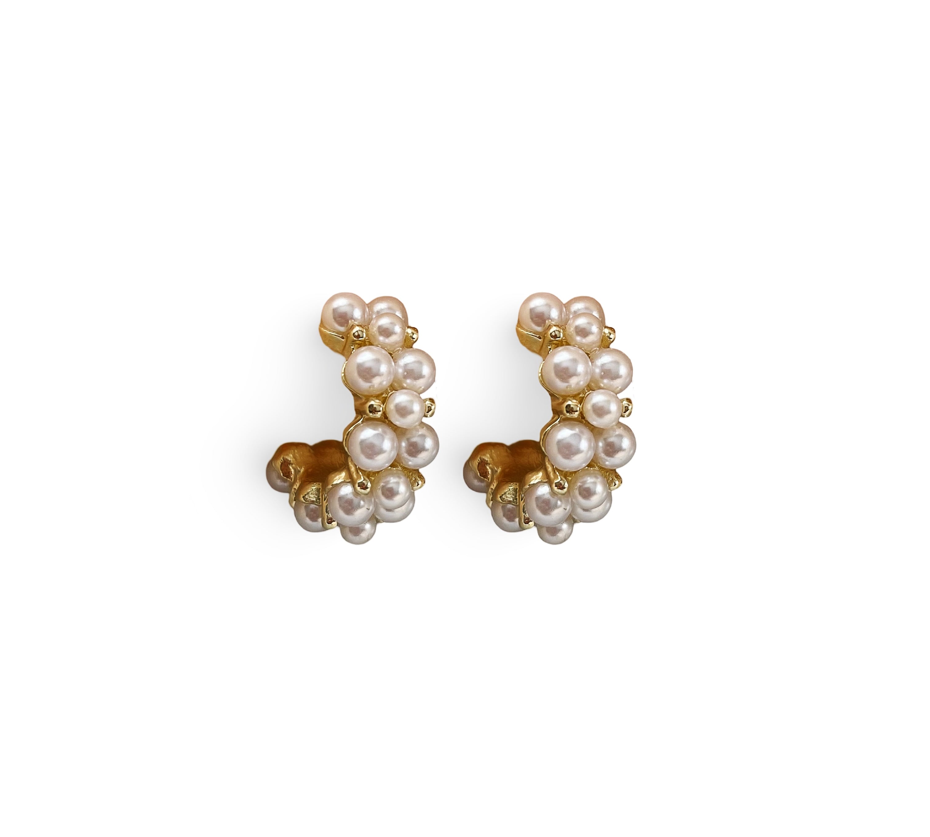 Small hoop earrings featuring a cluster of pearls, elegantly designed in gold for a sophisticated touch