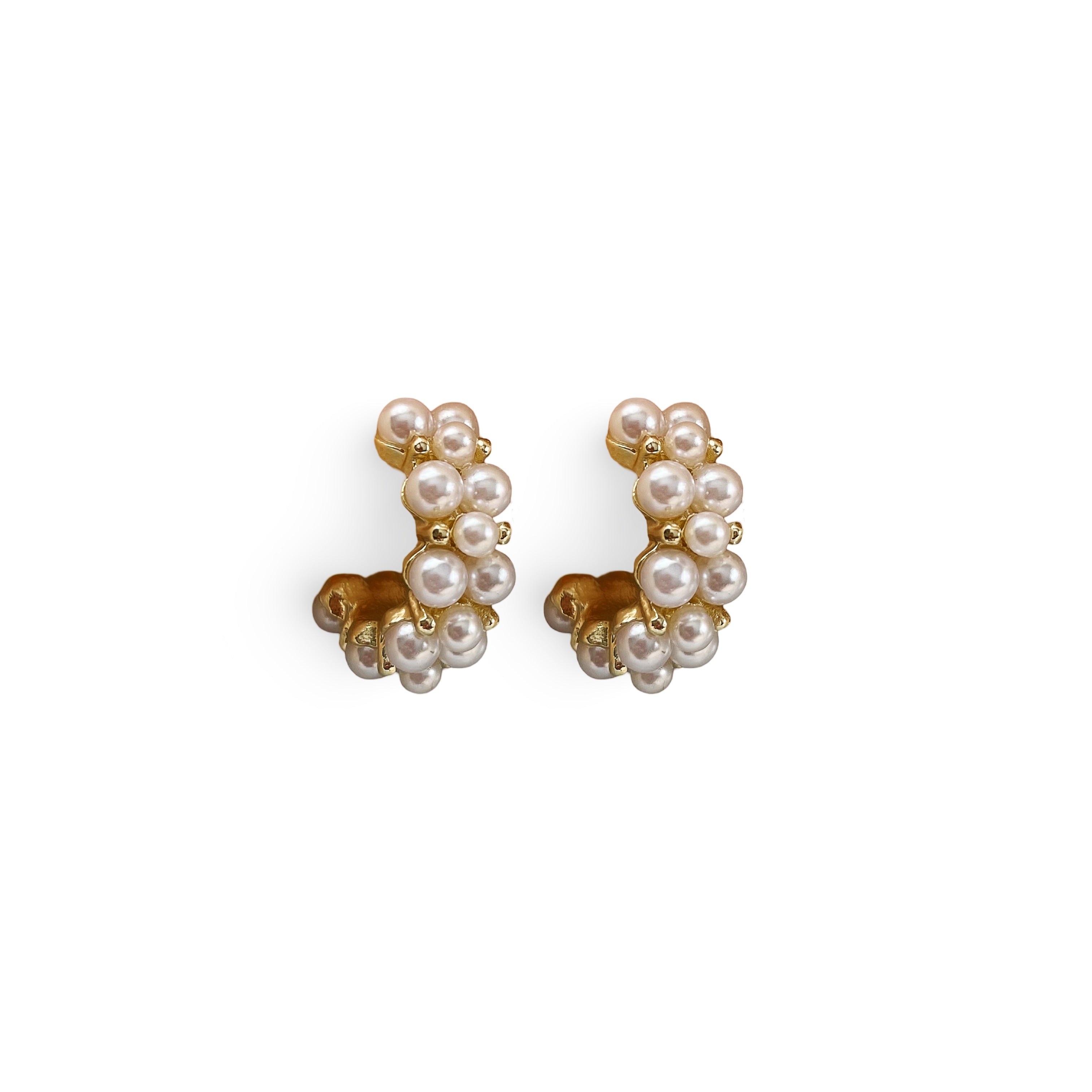 Small hoop earrings featuring a cluster of pearls, elegantly designed in gold for a sophisticated touch