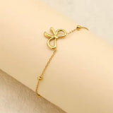 18k gold satellite chain bracelet featuring a bow design, crafted to be waterproof and hypoallergenic for everyday wear