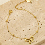 18k gold satellite chain bracelet featuring a bow design, crafted to be waterproof and hypoallergenic for everyday wear