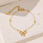 18k gold satellite chain bracelet featuring a bow design, crafted to be waterproof and hypoallergenic for everyday wear