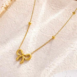 18k gold necklace satellite chain featuring a bow design, crafted to be waterproof and hypoallergenic for everyday wear