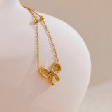 18k gold necklace satellite chain featuring a bow design, crafted to be waterproof and hypoallergenic for everyday wear