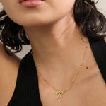 18k gold necklace satellite chain featuring a bow design, crafted to be waterproof and hypoallergenic for everyday wear