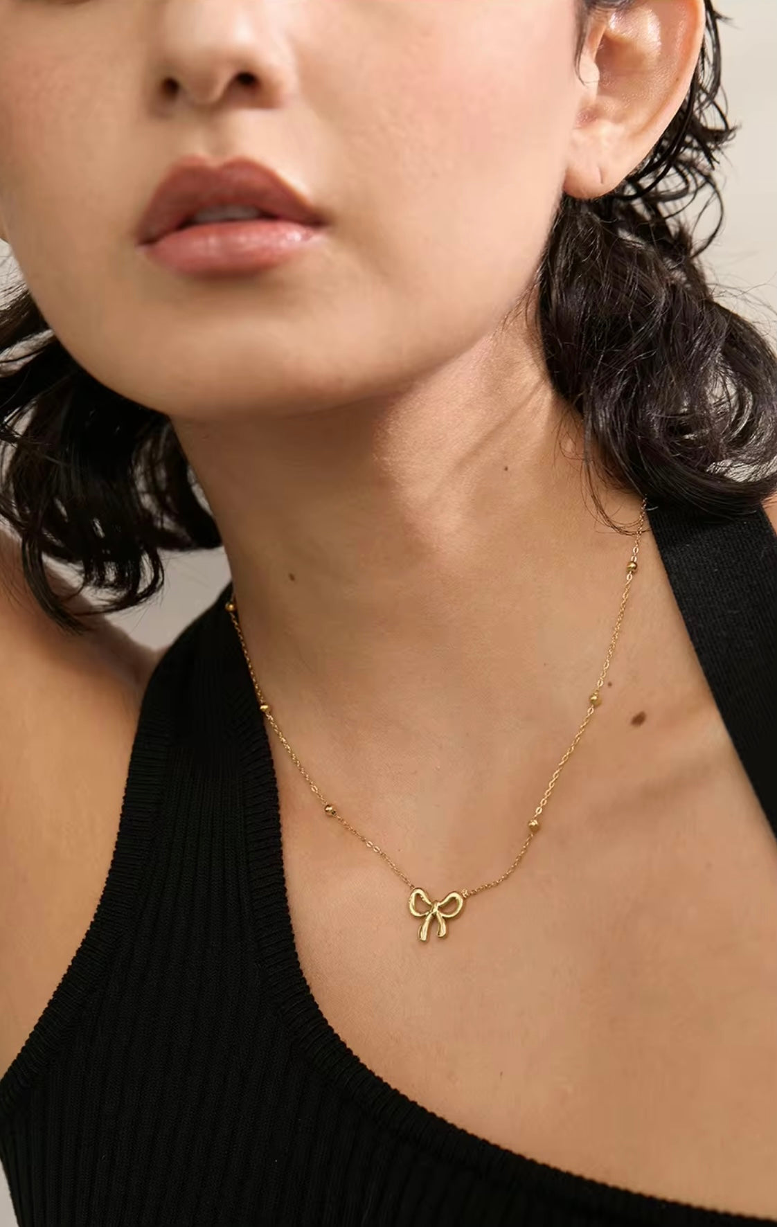 18k gold necklace satellite chain featuring a bow design, crafted to be waterproof and hypoallergenic for everyday wear