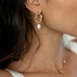 Abstract 18k gold earrings with a pearl drop, perfect for adding a unique and elegant touch to bridal attire